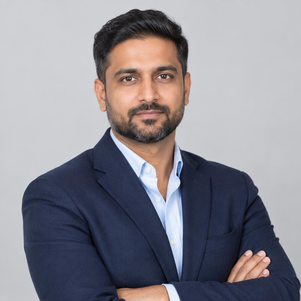 Studio portrait of a South Asian Canadian man in a blazer